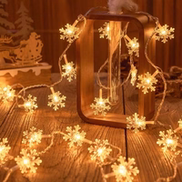 Lampki choinkowe LED snowflake/star -    3m/20 lampek ciepłe białe/warm balts zasilane bat. 3xAA EHD-LS04