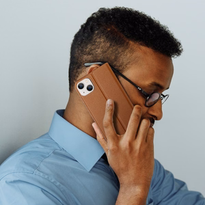 Dux Ducis Skin X2 viedtālruņa apvalks iPhone 14 Plus ar magnētisko atloku brūns