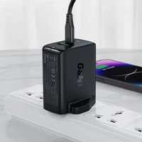 Acefast GaN 65W lādētājs ar 3 pieslēgvietām (1xUSB, 2xUSB C PD) ar Lielbritānijas spraudni - balts (A44)