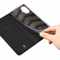 Dux Ducis Skin Pro viedtālruņa apvalks Realme 10 Pro+ ar atveramu vāciņu, maku ar kartēm un statīvu - melns