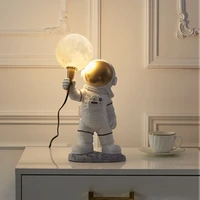 Mēness galda lampa ASTRONAUTS stāvošs Art Deco (modelis 1) AMTL