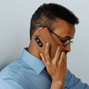 Dux Ducis Skin X2 viedtālruņa apvalks Samsung Galaxy S23+ atverams apvalks ar maku un statīvu brūns