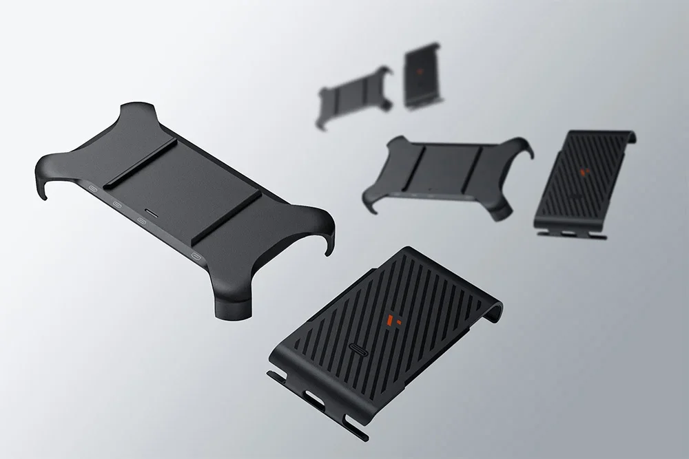 Various shots of the black holders and covers for the device, shown in unfolded form against a gray background