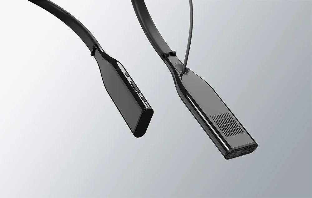 Divu kakla ierīču skats no sāniem ar pogām un ventilācijas atverēm uz gaiša fona