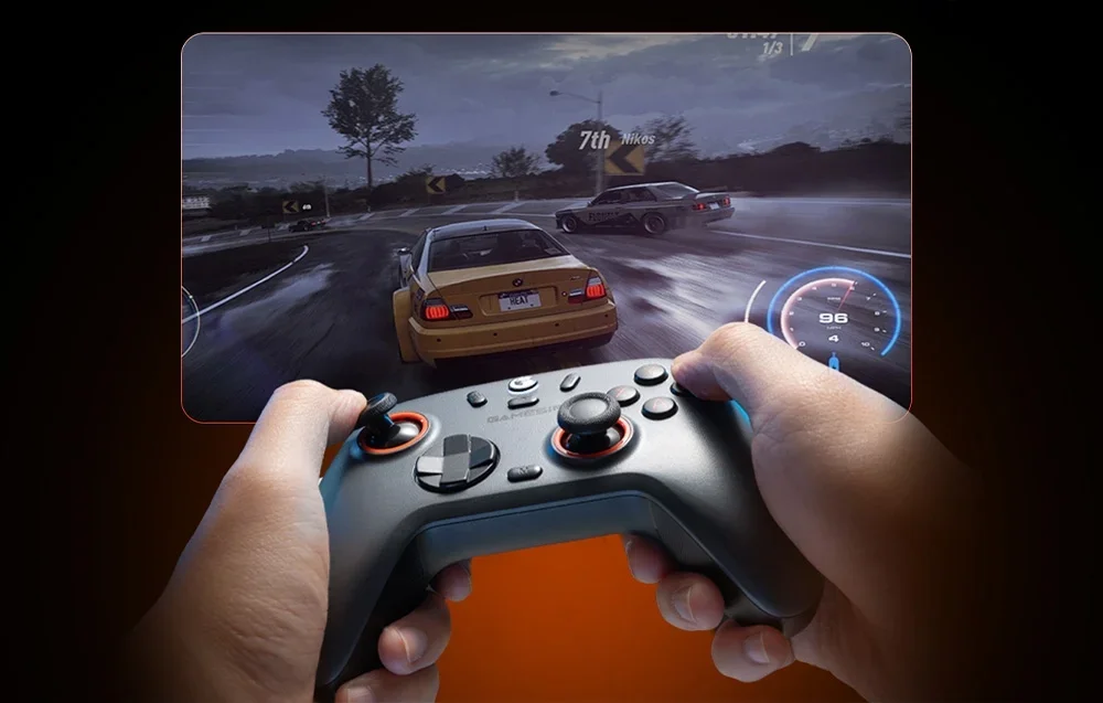 A person playing a racing game, holding a dark gray GameSir controller with red accents.