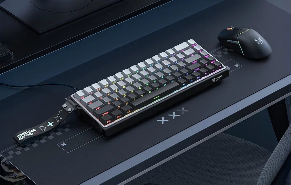Onikuma black keyboard on the desk next to the mouse